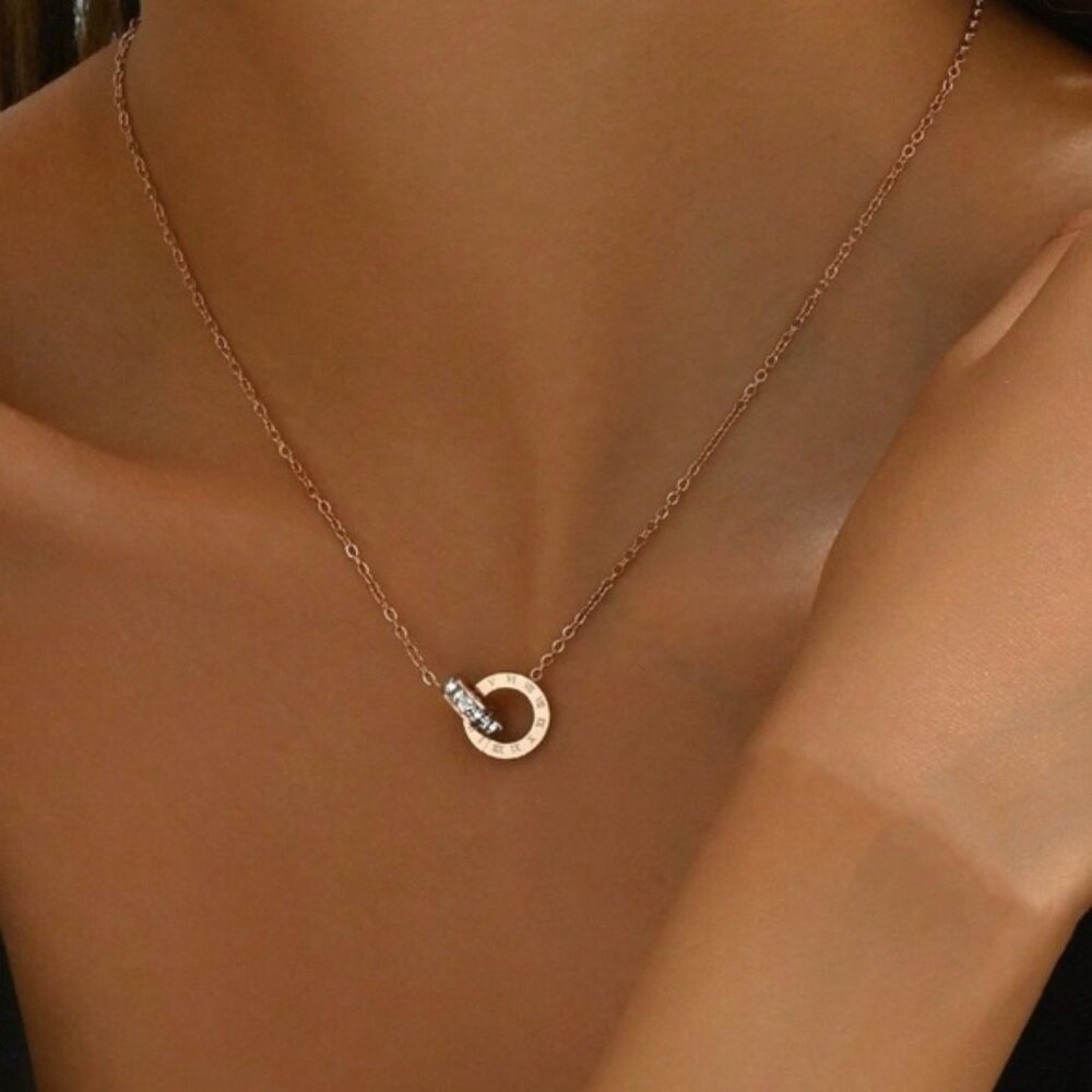 Roman numeral-engraved circles complemented by sparkling cubic zirconia